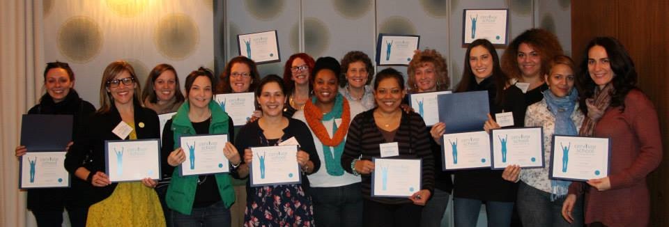 Tamika Felder stands with the first group of Cervivor School graduates, including Sara Lyle-Ingersoll, an honorary student whose best friend died from cervical cancer. The group is gathered in New York City for the inaugural Cervivor School in 2014.